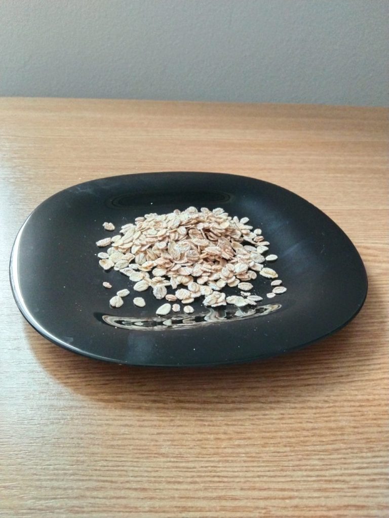 Oats on black place on table