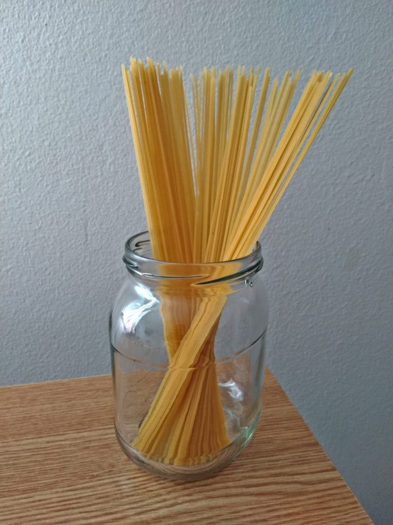 uncooked spaghetti glass bowl
